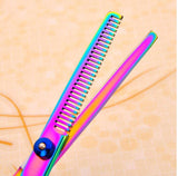 Pet grooming scissors with a colorful design and unique thinning features for professional pet hair cutting.