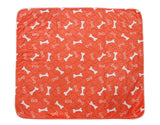 Three-layer Waterproof Pet Absorbent Pad in orange with white bone pattern, designed for comfort and strong water absorption.