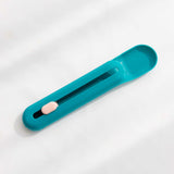 The Hot Cat Strip Spoon Feeder Squeezes Snack Pet Feeding Tools in turquoise color showing feeding mechanism.