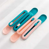 The Hot Cat Strip Spoon Feeder Squeezes Snack Pet Feeding Tools in teal and pink design.