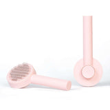 Pet Needle Comb Hair Remover Brush Dog And Cat Pet Comb Self Cleaning Massage Brushes Grooming Supplies in pink color.