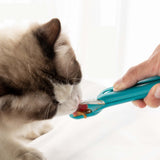 The Hot Cat Strip Spoon Feeder Squeezes Snack Pet Feeding Tools in use with a cat enjoying its treat.